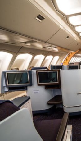 Business traveler working comfortably in premium cabin